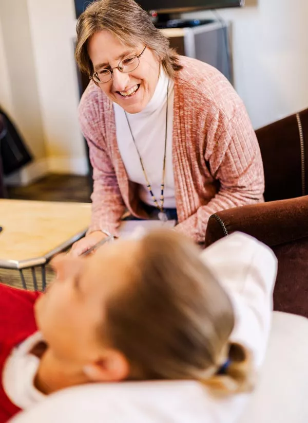 Angie speaking to a lying client